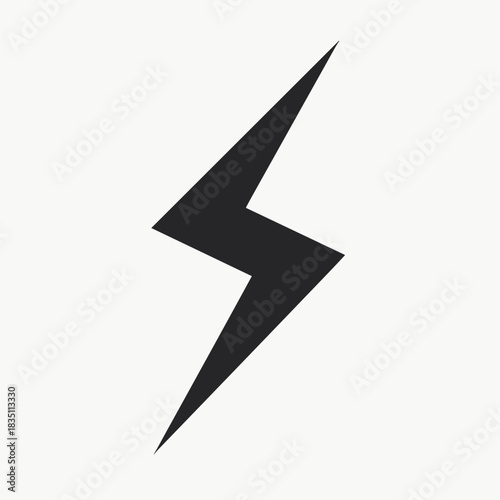 Solitary lightning bolt in dark grey on plain backdrop, evoking sudden electricity. Lightning bolt signifies power, speed, and impact, creating immediate visual interest.