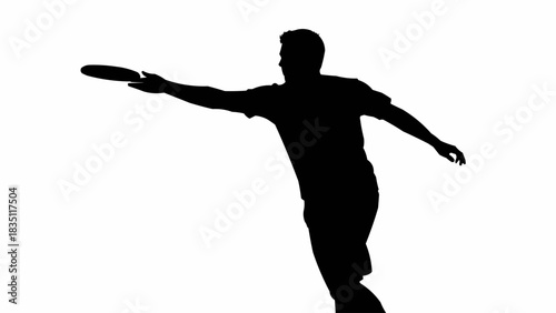 Silhouette of a man throwing a frisbee in mid-action.