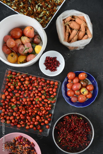 Autumn harvest from your own garden laid out in different bowls on the background