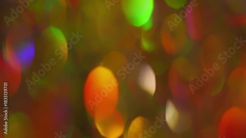 Multicolor Christmas Bokeh Seamless Loop. Festive abstract background of colorful glowing lights gently drifting and sparkling.