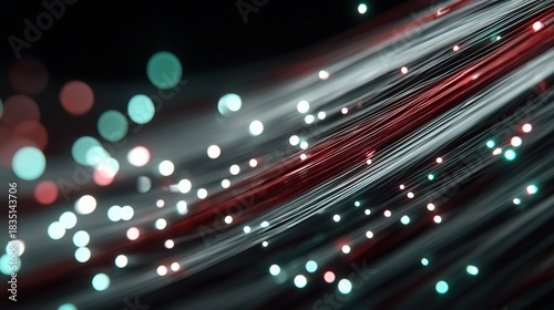 An abstract technology banner with light streaks and bokeh particles in motion.

