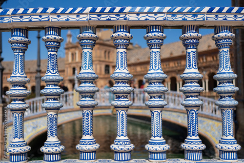 Decorative blue and white balustrade in Seville, Spain, with ornate architectural details