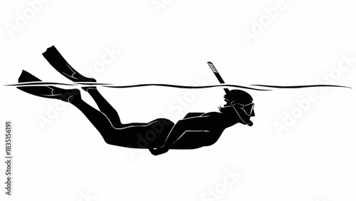 Silhouette of a person snorkeling in the water.