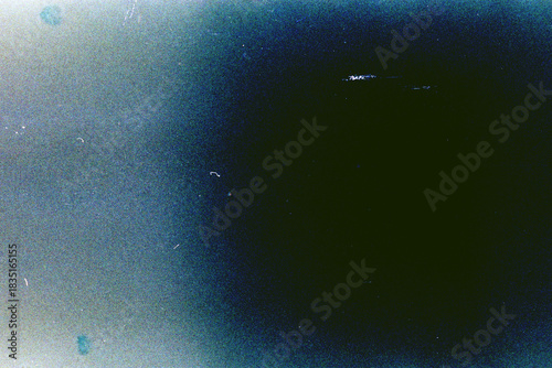 Blank grained film strip texture background with heavy grain, dust and light leak.