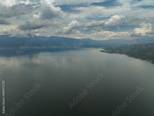 Aerial drone of Lake Singkarak among the mountains in West Sumatra, Indonesia.