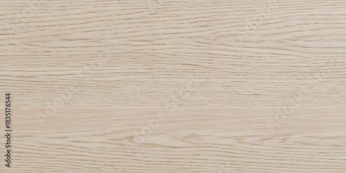 Close-up view of a pale, natural wood grain texture with subtle lines and a smooth surface, showcasing the organic pattern of the material