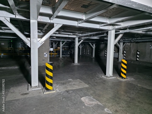 Hazard Safety Zone with Black and Yellow Warning Bollards in Industrial Facility