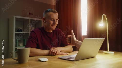 Business man see thump up remotely, thumbup like ok from laptop screen. Approval at home. Male employee virtual meeting. Successful distant interview. Guy good job video call. Work deal conference.