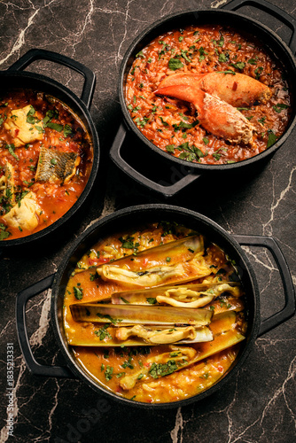 Portuguese traditional food fish soup  and seafood risotto meal on restaurant table in lisbon