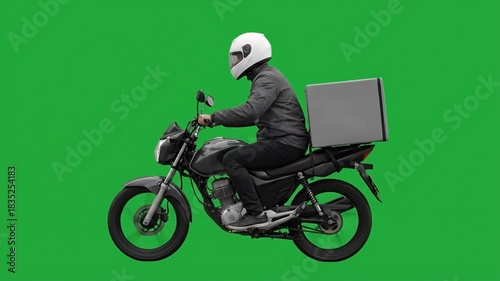 A person rides a motorcycle with a delivery box on a green screen.