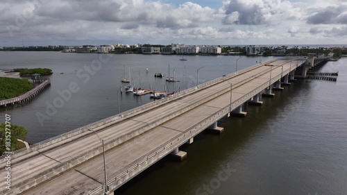 Wallpaper Mural Drone static shot facing northeast looking over the Intracoastal Waterway and the drawbridge in Lake Worth Beach Florida showing light traffic driving over the bridge Torontodigital.ca