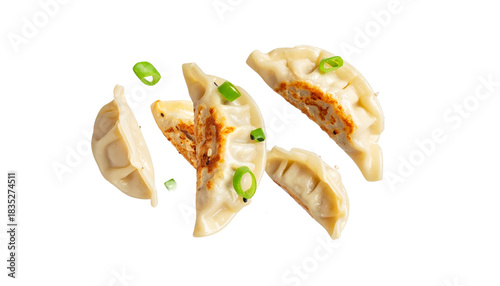 Delicious dumplings artfully arranged with fresh scallions, perfect for culinary delights