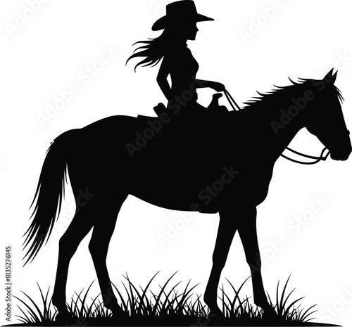Silhouette of a cowgirl riding a horse in a grassy field