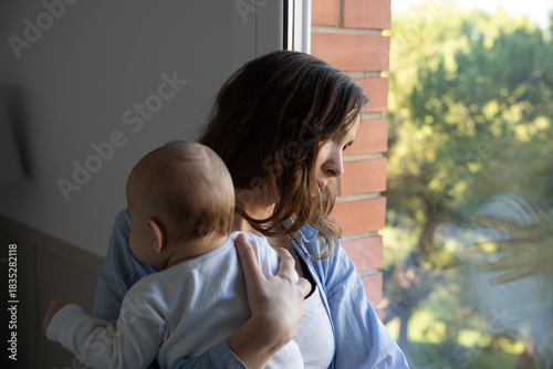 New mother experiencing sadness postpartum depression with baby