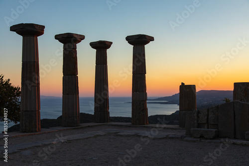 Fototapeta Naklejka Na Ścianę i Meble -  Assos Ancient City and Old Port Drone Photo,  Temple of Athena in the Sunset Time, Assos Behramkale, Ayvacik Canakkale, Turkiye (Turkey)