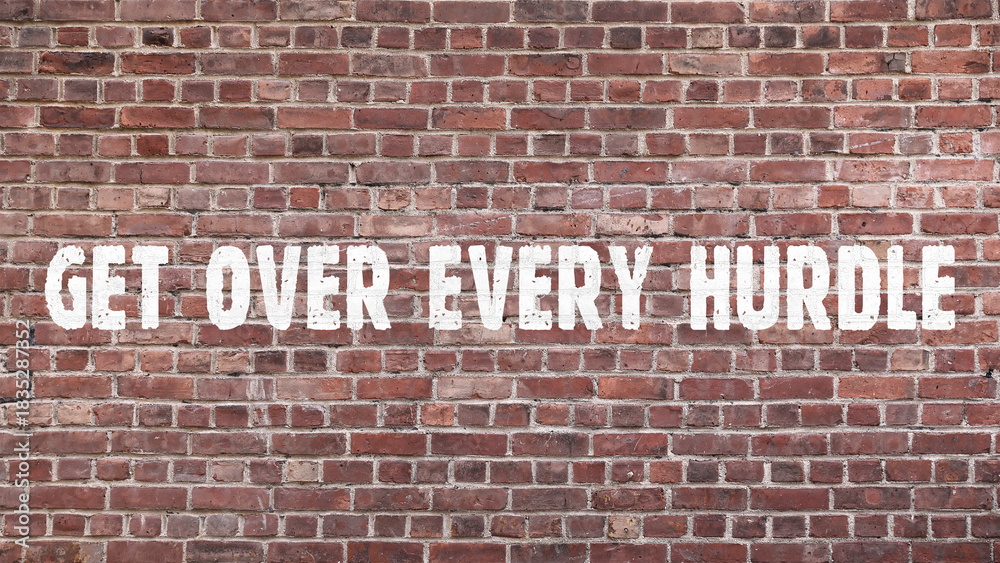 Fototapeta premium Inscription «get over every hurdle» on old brickwork