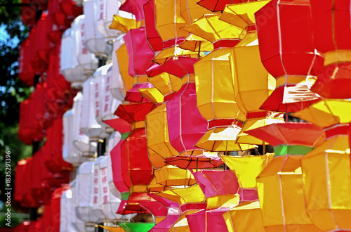 A collection of colorful paper lanterns, hanging in a festive arrangement 