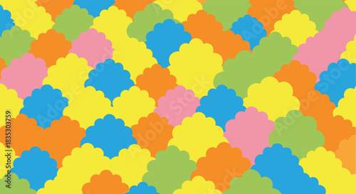 A vibrant and playful abstract seamless pattern with diagonally arranged scalloped shapes in a variety of bright happy colors.
