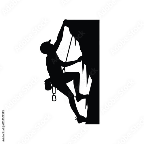 Silhouette of a rock climber ascending a steep cliff face