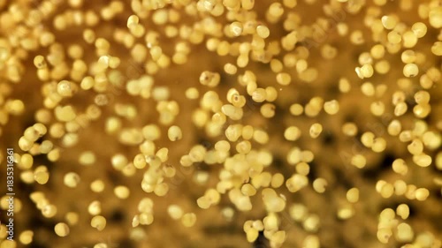 Millet groats fly against a dark background. Filmed on a high-speed camera at 1000 fps. High quality FullHD footage