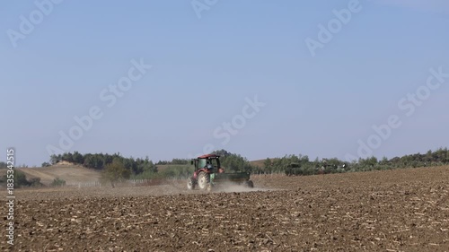 Wallpaper Mural Tractor Plowing Field Preparing Wheat Planting in December Torontodigital.ca