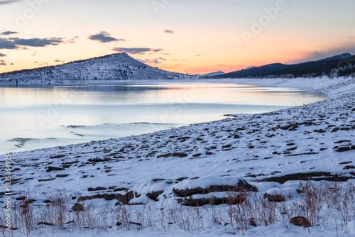 Winter Sunrise on a snowy Carter Lake in Loveland Colorado