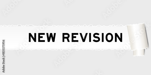 Ripped gray paper background that have word new version under torn part
