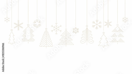 Delicate white paper cutouts of snowflakes and christmas trees hang from thin threads against a bright white background creating a festive and minimalist winter holiday decoration scene