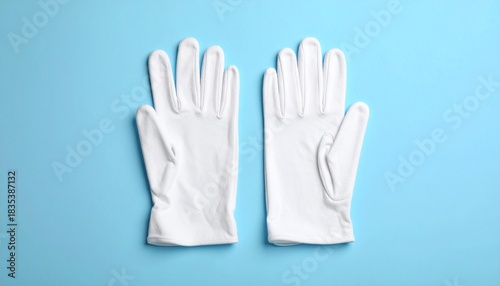 Wallpaper Mural White Fabric Gloves with Gathered Cuffs on Light Blue Surface Torontodigital.ca
