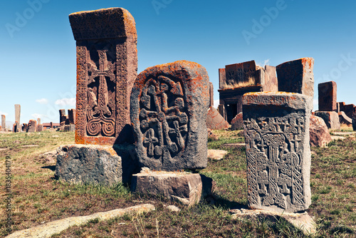 Khachkar - medieval Armenian headstone bearing cross, life scenes or decorative interlaces and botanical motifs. Noratus cemetery, Gegharkunik Province, Armenia