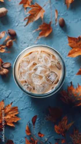 Autumn Iced Coffee Flat Lay with Fall Leaves and Blue Background