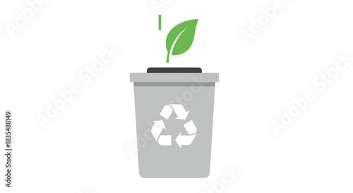 Recycle bin with a green leaf coming out of it