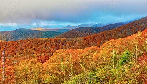 autumn landscape in the blue ridge mountains with  dramatic sky, and strong light and shadow for perspective and depth