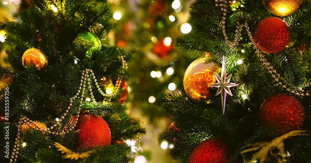 Naklejka premium Christmas background. beautiful christmas tree with festive decor, colorful balls, glowing garlands close up. Symbol of New Year, Christmas, Advent, Yule holidays, winter season. selective focus