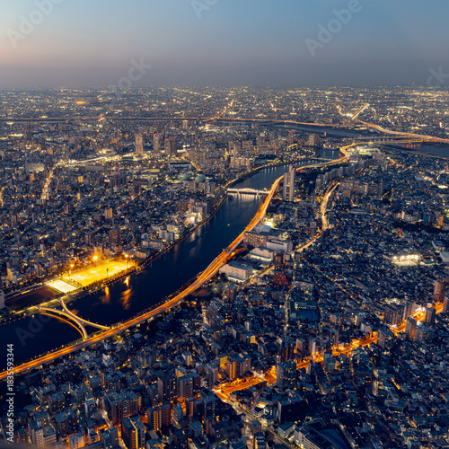 Tokyo Night Cityscape with River and Highway Lights from Above