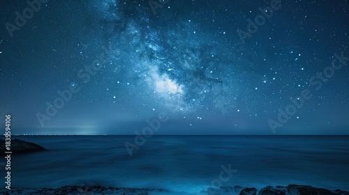 Serene Night Beach Shoreline with Gentle Waves, Star-Dense Sky, and Milky Way Reflections; Calm Dark Blue Ocean Surface Glowing Under Moonlight, Gradient Sky Reflections; Massive Curling Ocean Waves