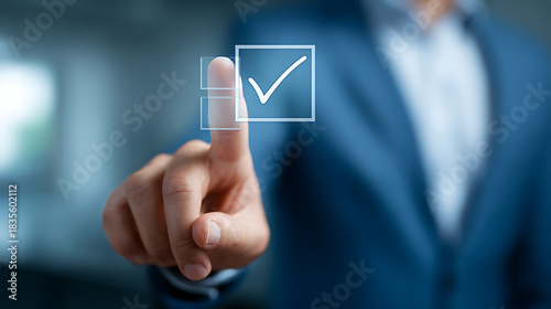 Person in blue suit touches digital checkmark on screen finger touching
