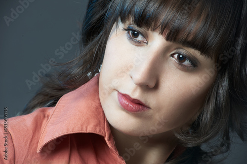 Young woman looking away in thoughtful pose