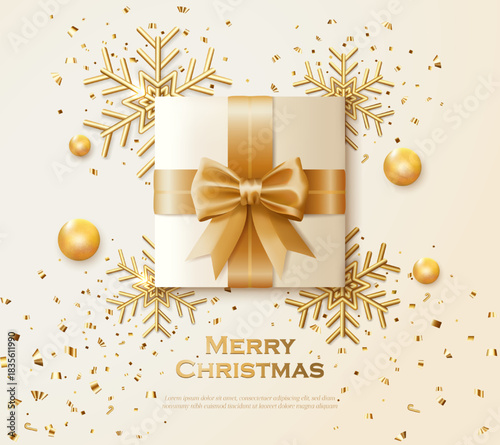 Christmas greeting card with gift box and gold snowflake decoration