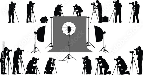 Photographers capturing images in professional studio setup with lighting equipment, backdrops, tripods, and cameras, showcasing creative photography environment and teamwork.