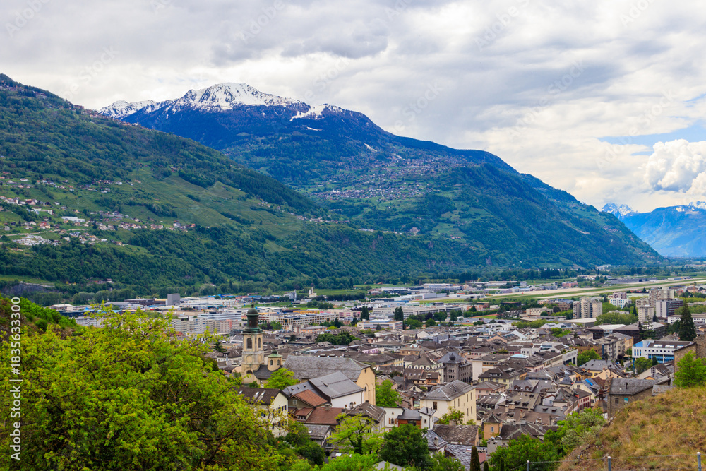 Obraz premium Panoramic view from a hill over City of Sion with and Swiss Alps in Canton Valais, Switzerland