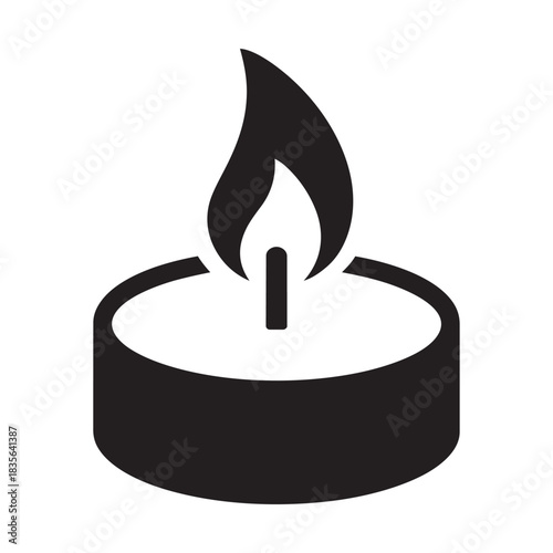 Single tea light candle with flame burning