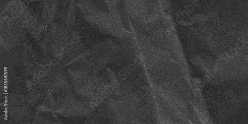 Dark crumpled paper pattern with rough grain. Noisy halftone dust layer and old blank surface, textured grunge backdrop for graphic layouts.
