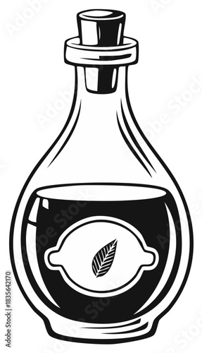 Vintage glass bottle with cork stopper containing dark liquid and a leaf symbol on label