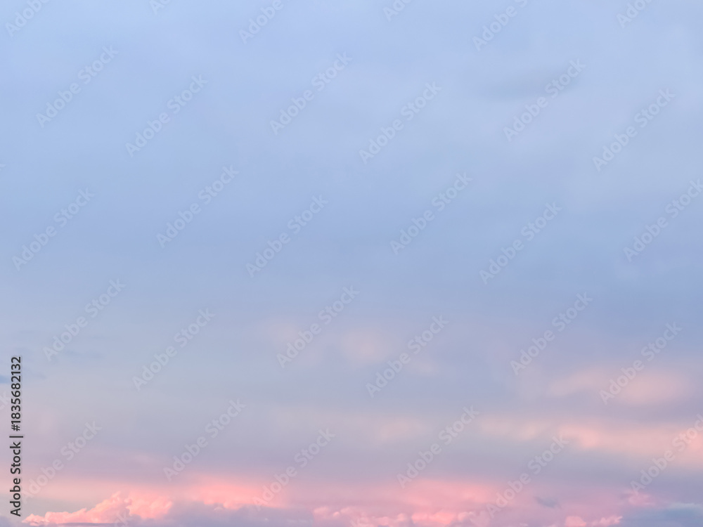 Fototapeta premium Vibrant Sunset Clouds over Pastel Sky