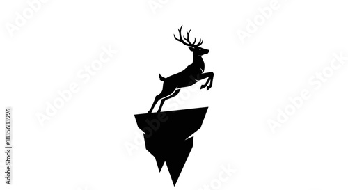 Silhouette of a majestic stag leaping from a rocky outcrop.