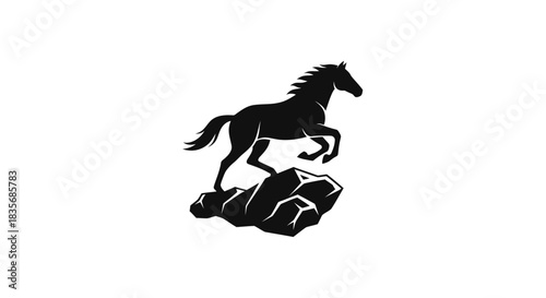Majestic black horse silhouette leaping from rocky terrain against white background.