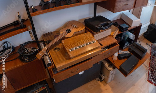 Wallpaper Mural Overhead view of wooden desk with accordion guitar and vintage audio equipment in studio. Shot with anamorphic lens. Torontodigital.ca
