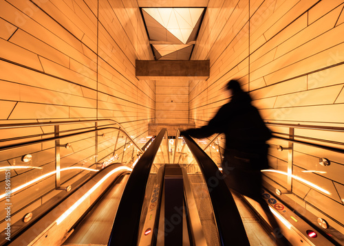 Photography people on the subway escalator with intentional motion blur
