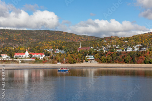 Panorama of Tadoussac, Quebec, Canada from the St. Lawrence River on an Autumn Day with Fall Colors and Sailboats in the Harbor